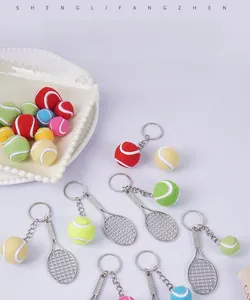 Close-up of colorful mini tennis ball and racket pendants in various vibrant colors