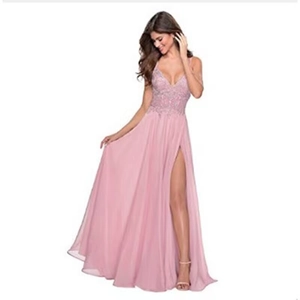 Detail of pink chiffon evening gown with lace embroidery and high leg slit feature