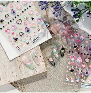 Detail of 3D embossed rabbit playing card nail art stickers with textured relief patterns