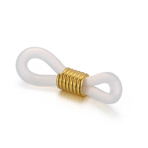 Macro shot of white silicone eyeglass chain connectors with golden metal sliders