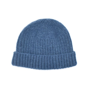 Detail of dark blue knit beanie showing ribbed texture and soft wool blend fibers