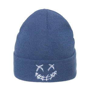 Close-up of white face embroidery on dark blue knitted beanie with ribbed texture