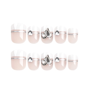 French tip short square press-on nails in nude pink with silver lines and heart rhinestones