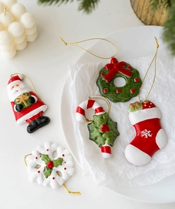 Set of 5 ceramic Christmas ornaments with Santa, wreath, and snowflake on gold cords