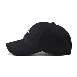 Black cotton baseball cap with white cursive embroidery on a clean white background