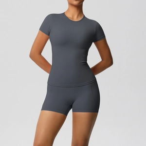 Close-up of dark grey high-stretch nylon fabric and stitching on yoga shorts set