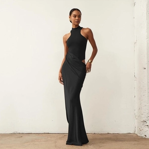 Detail of the elegant waist cutout and silky fabric on the black mermaid dress
