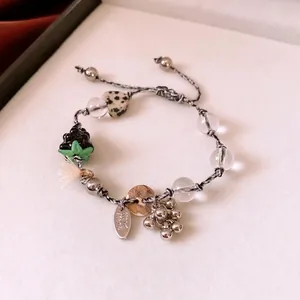 Handmade beaded bracelet with heart glass, spotted stones and luxury braided tassel cord