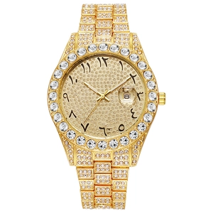 Macro detail of gold luxury watch bezel and dial with iced-out crystals and Arabic numerals