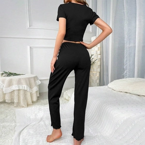 Rear view of black ribbed short sleeve top and matching pants loungewear set