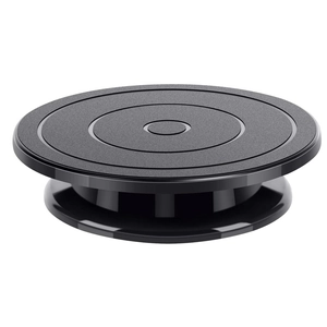 Detail of black cake turntable featuring anti-slip concentric texture and matte finish