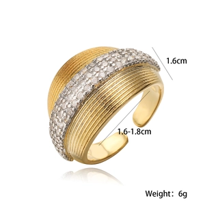 Gold plated geometric open ring with textured stripes and micro-set zirconia