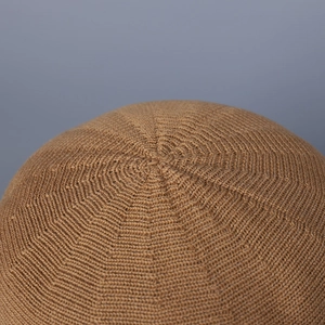Detailed close-up of the knitted crown on a khaki sun hat showing radial stitch patterns