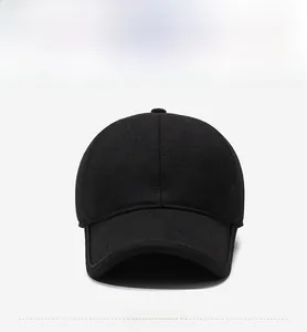 Front view of black winter baseball cap with ear protection and metal R logo detail