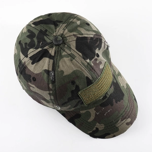 Detail view of the distressed camouflage baseball cap with an American flag patch side
