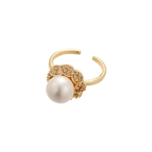 Elegant gold open ring with large white pearl and zircon flower halo on white background
