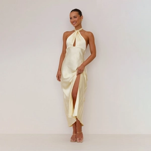 Detailed view of cream satin halter dress featuring sexy front cutout and high side slit