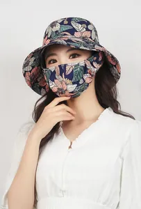 Detail of outdoor sun hat with navy floral neck flap and large protective brim