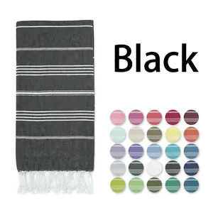 Detail of black striped Turkish towel with fringe and a palette of 25 available colors