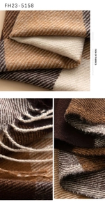 Close-up of brown plaid scarf texture with soft twill weave and tassel edge details