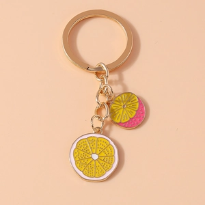 Fresh lemon slice keychain with gold-tone rings and colorful enamel fruit charms