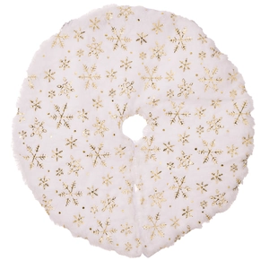 Detail view of mini white plush Christmas tree skirt with golden snowflake patterns