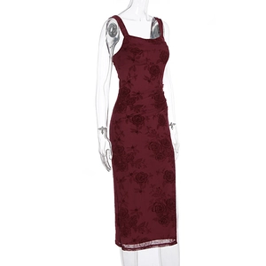 Detailed view of the artistic side ruching and dark red rose floral print on the dress
