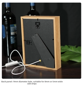 Detail of the wooden light box back panel featuring a 9mm wire hole and hanging hook