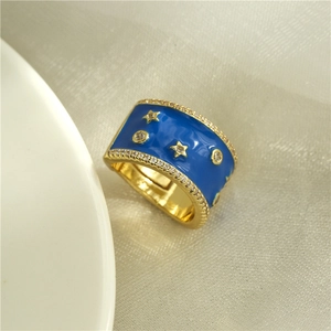 Golden wide band ring with blue enamel and star zircon inlay on textured satin