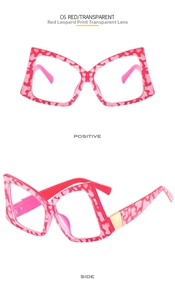 Macro detail of red leopard print butterfly glasses frame with gold metal hinges