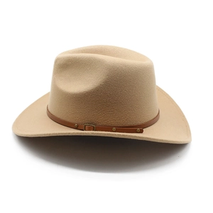 Close-up of beige felt cowboy hat featuring brown leather band with metal rivets
