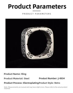 Detail view of vintage steel signet ring featuring tribal engravings and antique finish