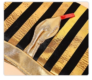 Close-up of gold and black Egyptian pharaoh hat texture with metallic coated fabric