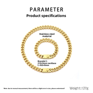Macro view of gold stainless steel cuban chain necklace and bracelet jewelry set