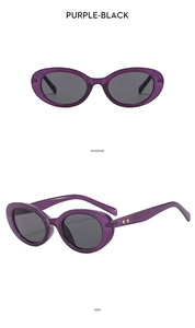 Detail view of oval sunglasses in purple-black with golden star accents on side frame