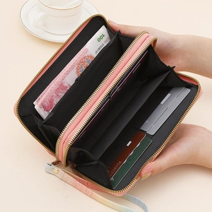 Detail view of large capacity pink gradient wallet showing card slots and zipper pocket