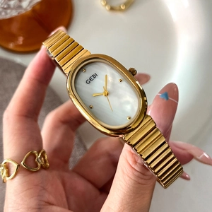 Elegant gold oval quartz watch for women with mother of pearl dial and snake chain band