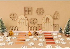 Miniature wooden Christmas DIY kit with tiny doors, fences, and winter scene accessories