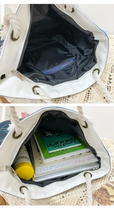 Detail view of jacquard tote bag interior with zipper pocket and large capacity storage