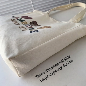 Minimalist beige canvas tote bag with cartoon bear embroidery and large capacity