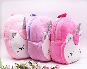 Three plush unicorn backpacks in pink and purple colors for children kids school