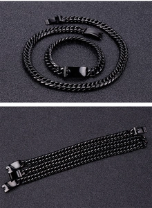 Detail view of black stainless steel curb chain featuring a secure fold-over clasp