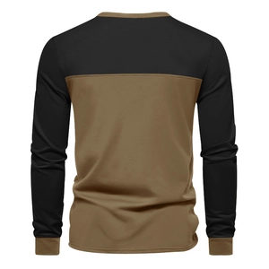 Detail view of men's long sleeve patchwork tee featuring black and brown knit textures