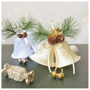 Detail of velvet Christmas bells with glitter pine cones and gold candy ornaments