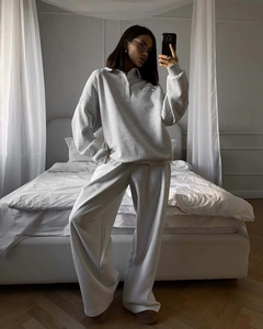 Detailed knit texture of light grey oversized lapel sweatshirt with letter print logo