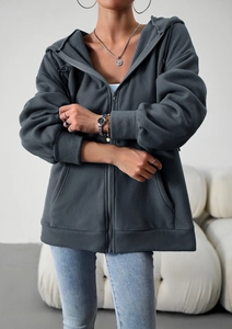 Detail of loose fit dark grey fleece zip-up hoodie with hood and high quality fabric texture