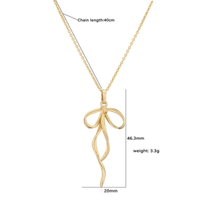 Detail of gold ribbon bow necklace with size dimensions: 46.3mm by 20mm and 40cm chain