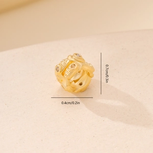 Macro shot of gold-plated spacer bead with cubic zirconia and exact dimensions