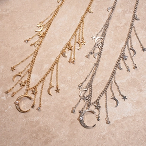 Layered gold and silver star moon waist chains with faux pearls and crystals