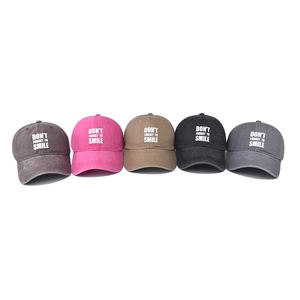 Faded cotton baseball caps in five colors with Don't Forget to Smile slogan